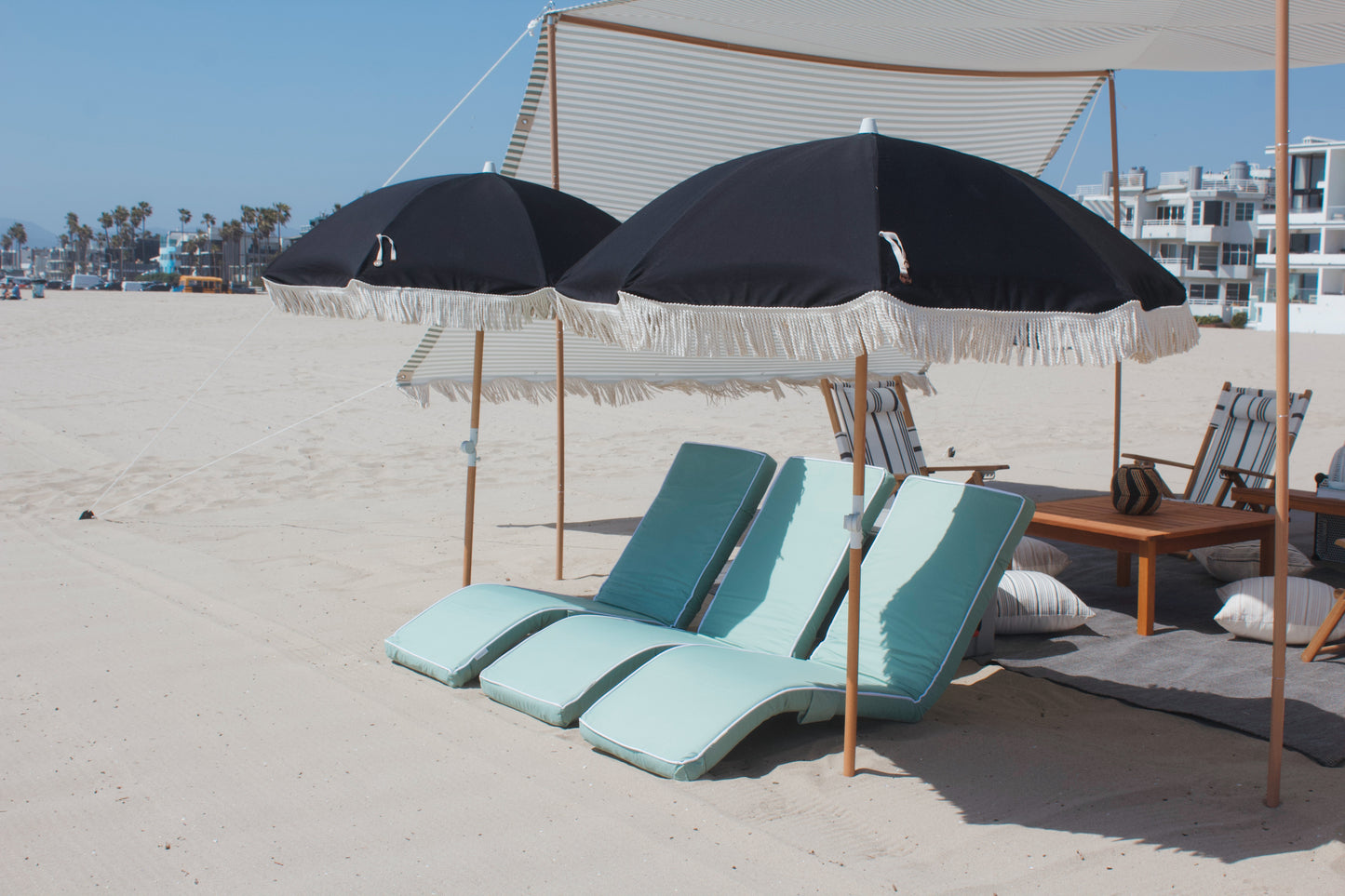 Beach lounge rental with beach lounges, umbrellas and beach chairs on Los Angeles beach