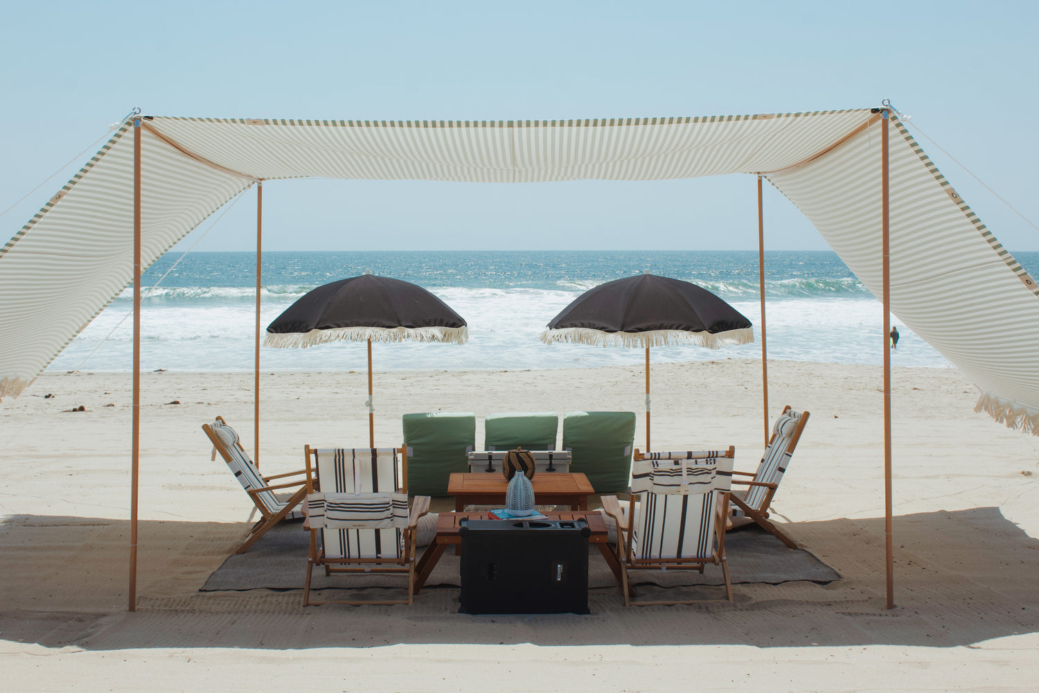 The Villa beach cabana rental with large tent, umbrellas, beach chairs, and lounges in Marina Del Rey, Los Angeles