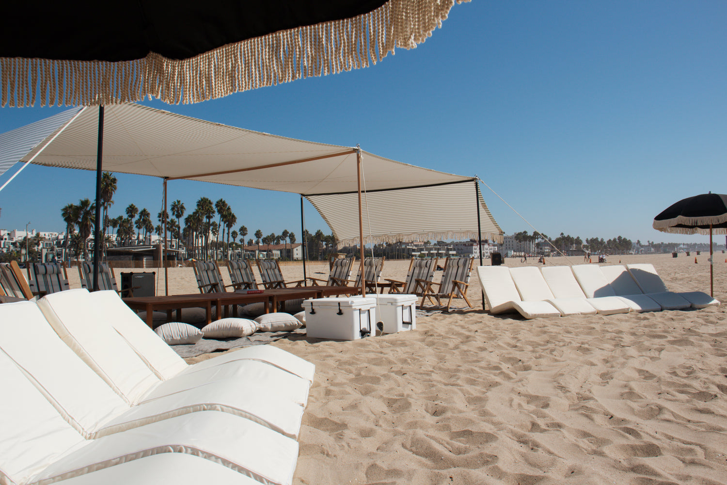 Large beach cabana rental in Los Angeles for corporate events and special events with beach chairs, beach lounges, beach umbrellas, and beach tent.
