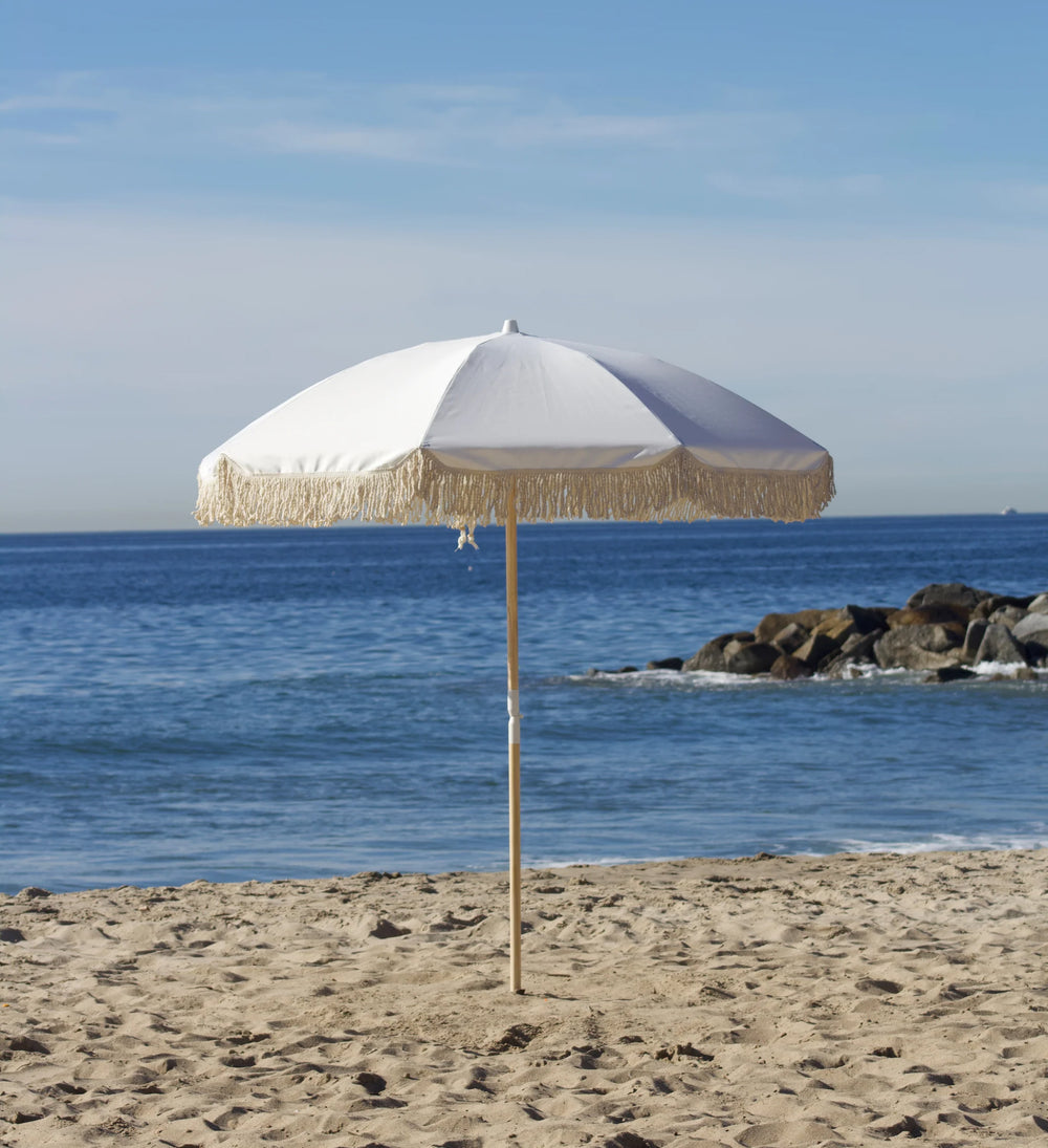 Extra white beach umbrella add-on for more shade at a Beach Oasis cabana