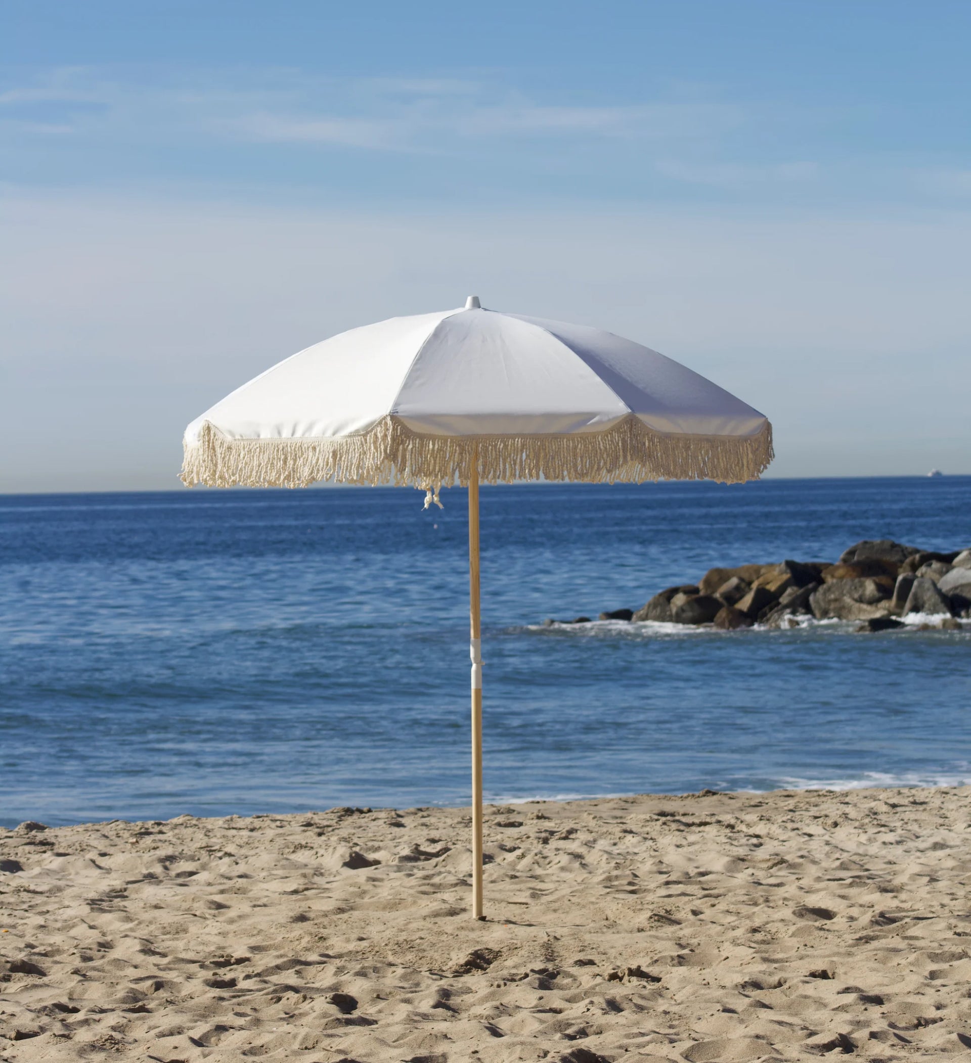 Extra white beach umbrella add-on for more shade at a Beach Oasis cabana